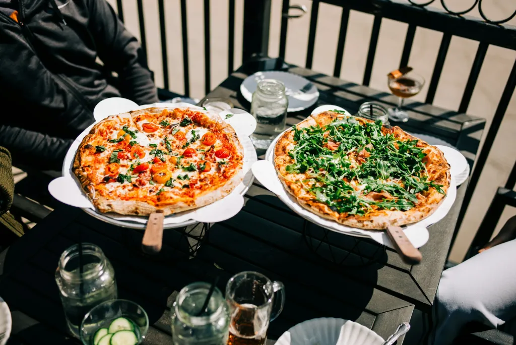 two pizzas served at a cafe