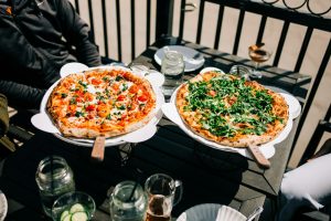 two pizzas served at a cafe