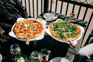 two pizzas served at a cafe