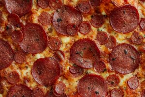 2 kinds of pepperoni on a pizza